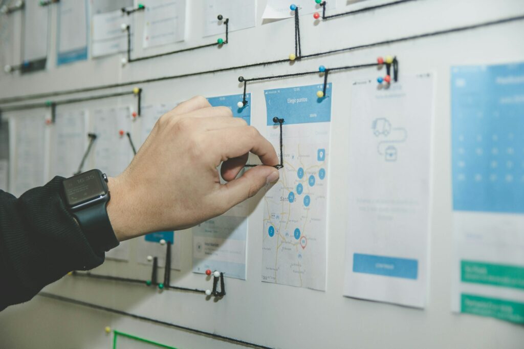Hand drawing a process diagram on a whiteboard