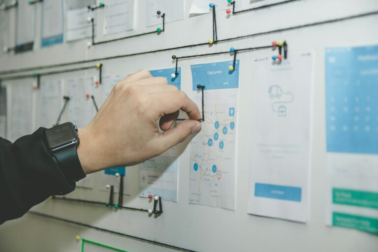 Hand drawing a process diagram on a whiteboard