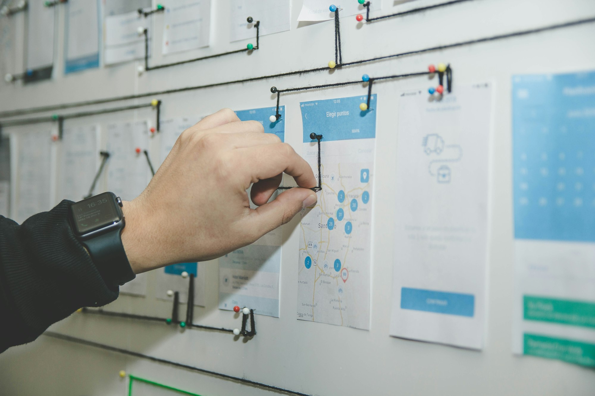 Hand drawing a process diagram on a whiteboard